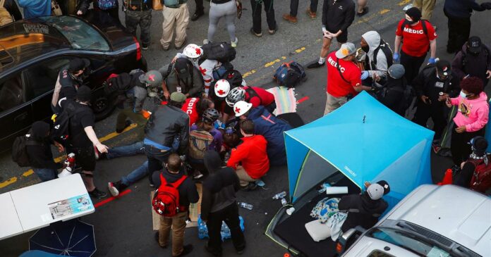 Man drives into Seattle George Floyd protest, shoots one protester