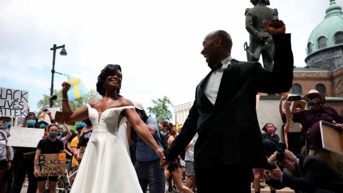 Newly married couple joins Philadelphia protests immediately after wedding
