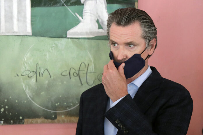 Newsom charges ahead as California virus cases reach new record