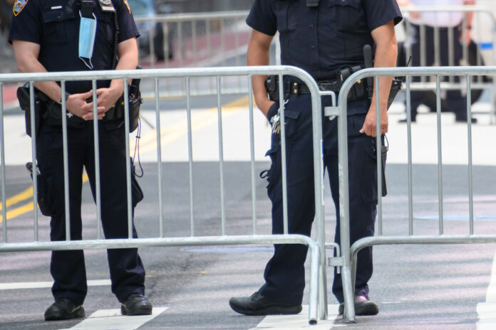 NYPD cop stripped of gun, shield for opening car door on protester