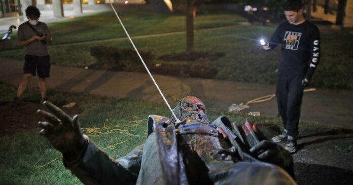 Protesters in Washington, D.C., topple and set ablaze Confederate statue