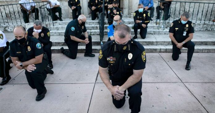 Some police step out to show support for George Floyd demonstrators