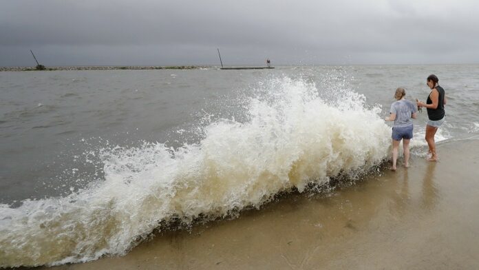 Tropical Storm Cristobal could regain strength by combining with new storm system after drenching South