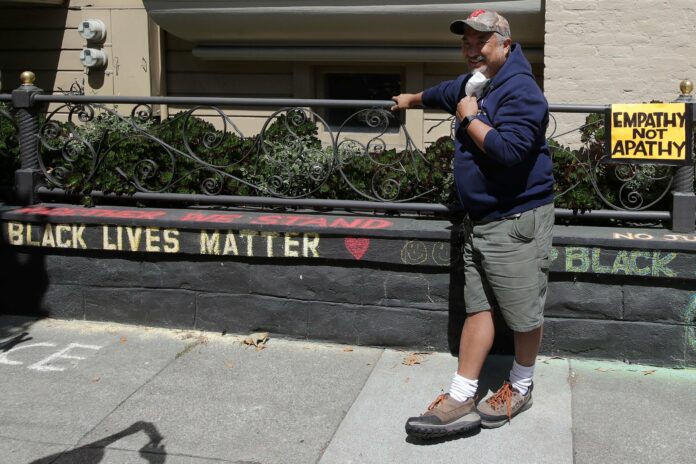 Woman apologises for telling man he was illegally defacing his own home with ‘Black Lives Matter’ slogan
