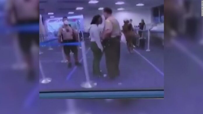 A Miami-Dade officer struck a woman at an airport will be terminated, officials say