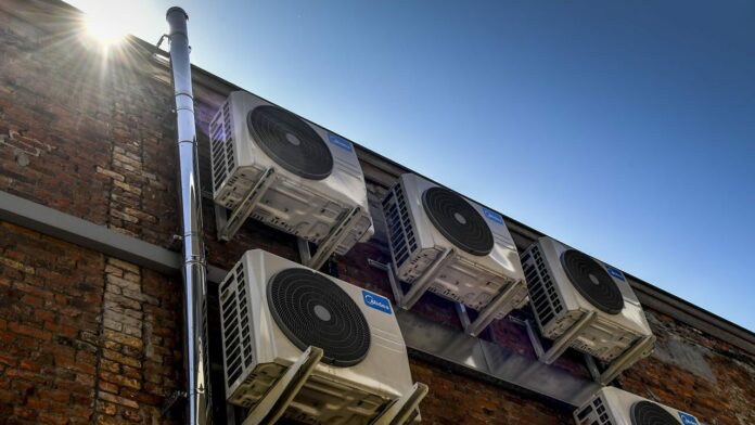 Air conditioners could be aiding the spread of COVID-19 indoors, epidemiologists say
