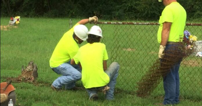 Black and white cemeteries in a Texas town were separated by a fence. It’s come down.