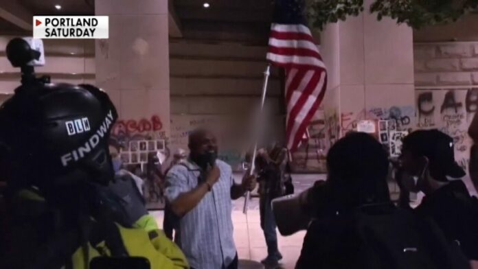 Black Marine vet holds US flag high amid chaotic Portland protest, gets followed home by Antifa