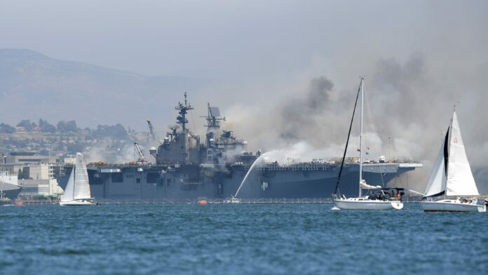 Blaze continues to rage on USS Bonhomme Richard nearly 24 hours after the fire; nearly 60 injured