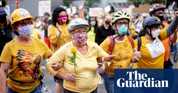 ‘I wanted to take action’: behind the ‘Wall of Moms’ protecting Portland’s protesters