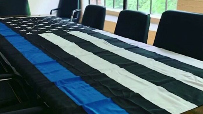 Media company doubles down on pro-police flag