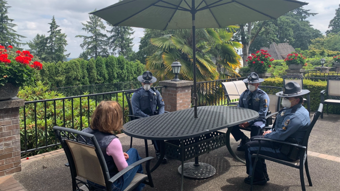 Oregon governor meets with state troopers caught flouting mask mandate in coffee shop