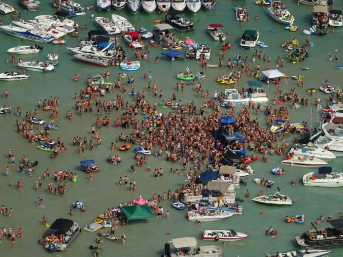 Several people at massive Torch Lake July 4 party have tested positive for coronavirus