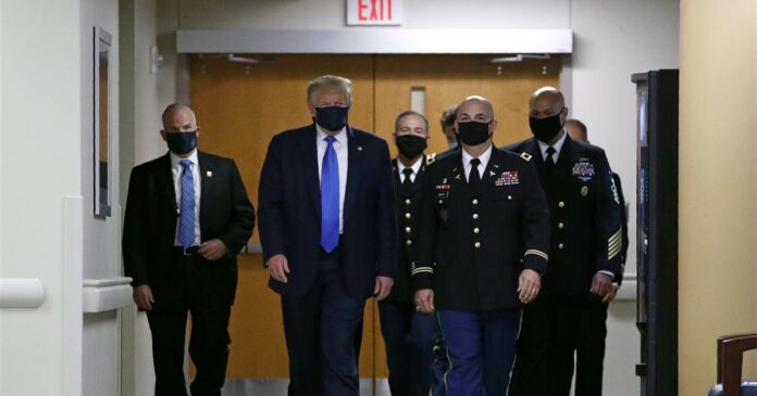 Trump wears mask in public setting for the first time during visit to hospital