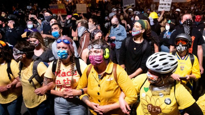 ‘Wall of moms’ at Portland protest formed to protect demonstrators