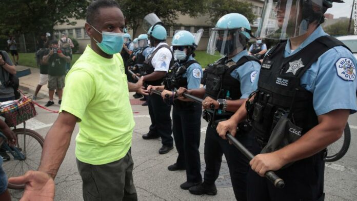 A violent protest in Chicago leads to 2 dozen people arrested and 17 officers injured