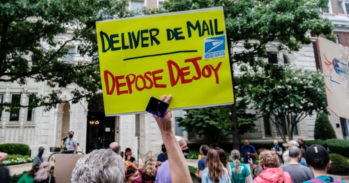 Protesters gather at Postal Service boss’ home amid concerns over mailed ballots delays