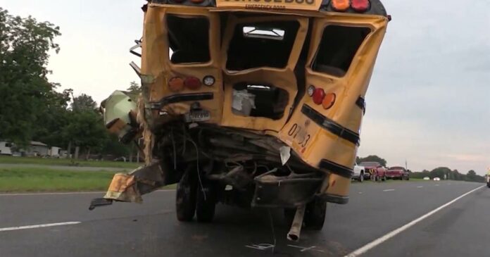 Truck driver in crash with school bus helps free trapped students before he collapses