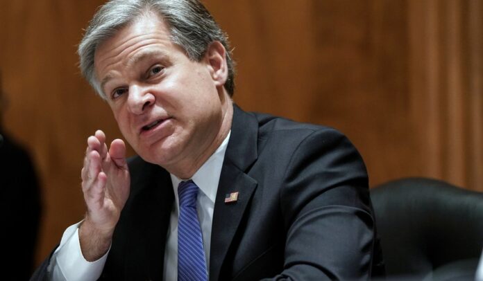 China still spying on U.S. coronavirus vaccine efforts, Wray tells Congress