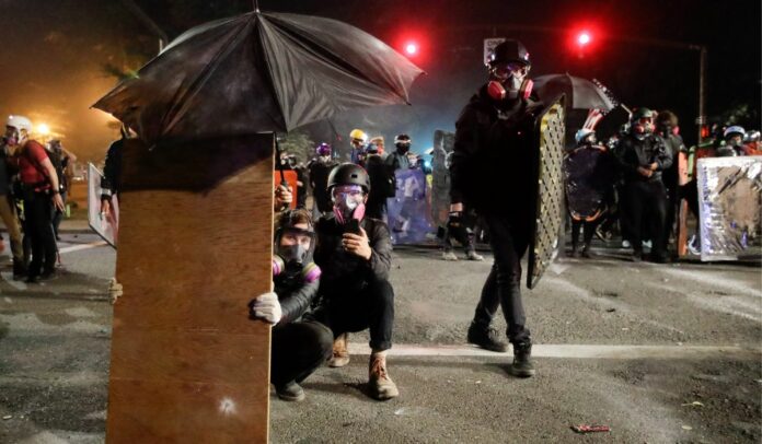Portland protesters use new, old tactics against police