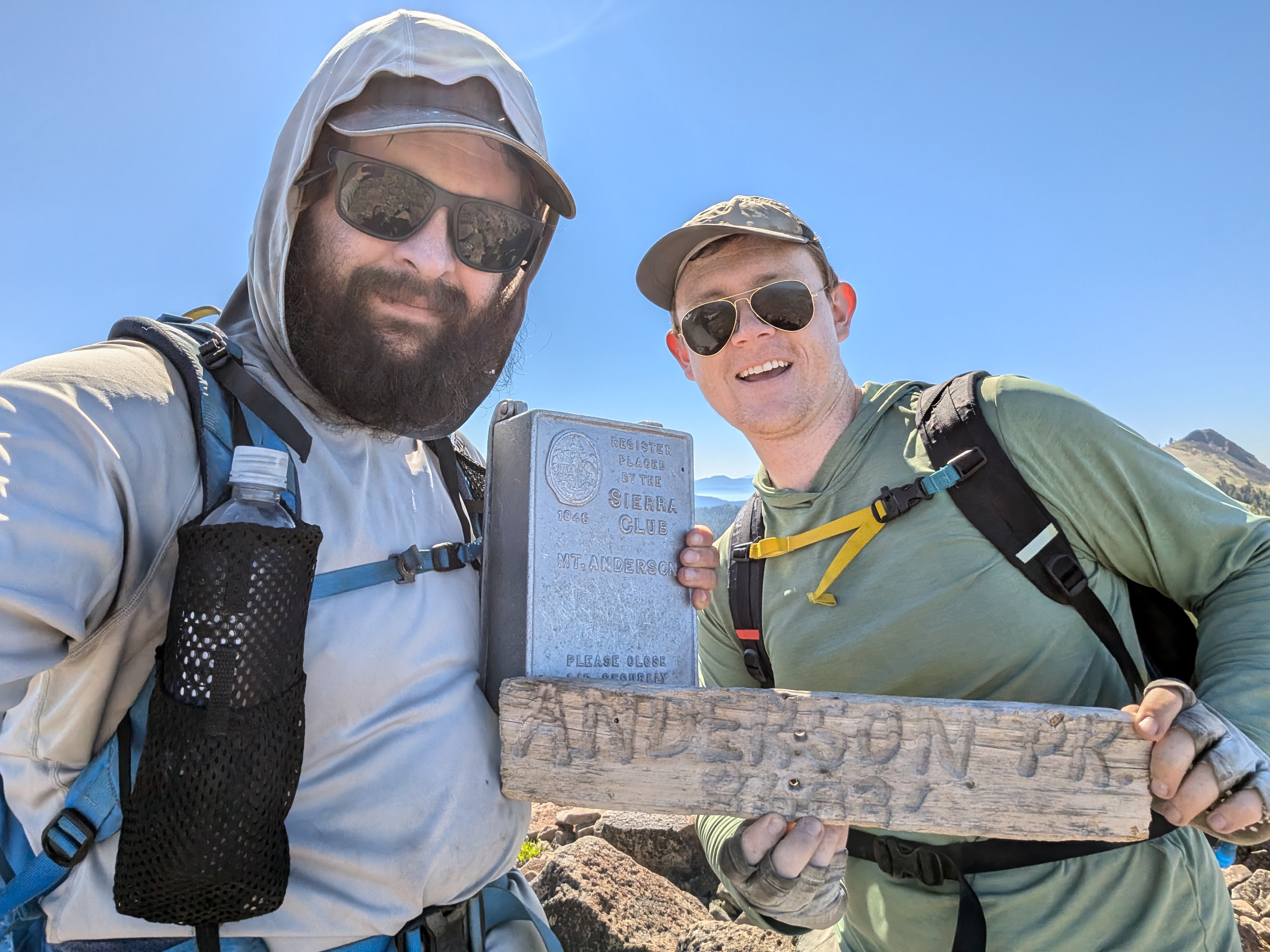 Me and Chris with the register and summit sign