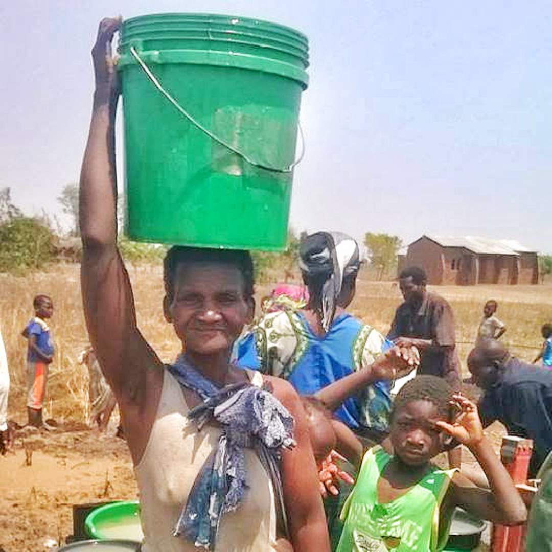 Mother carrying water